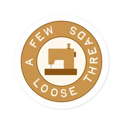 Golden A Few Loose Threads Round Sticker